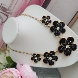 Kate Spade " Graceful Floral" Navy and Gold necklace. Enamel look with gold.